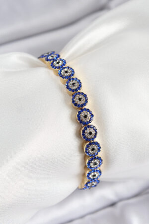 Pirinç Zirkon Taşlı Lacivert Nazar Model Gold Renk Lastikli Kadın Bileklik